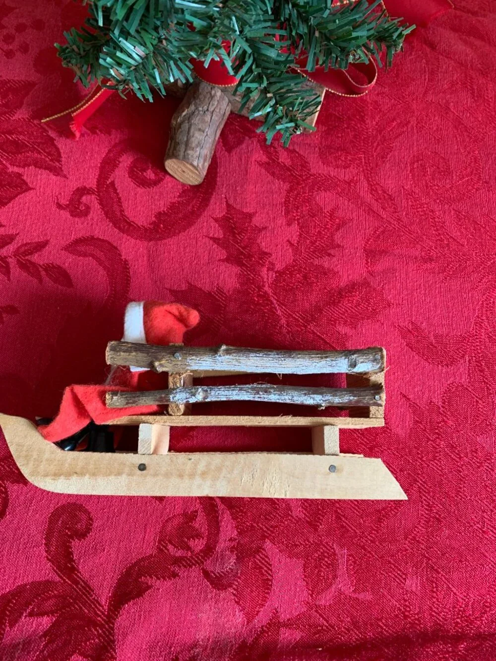 Vintage Santa Claus in rustic wooden sleigh Christmas decoration